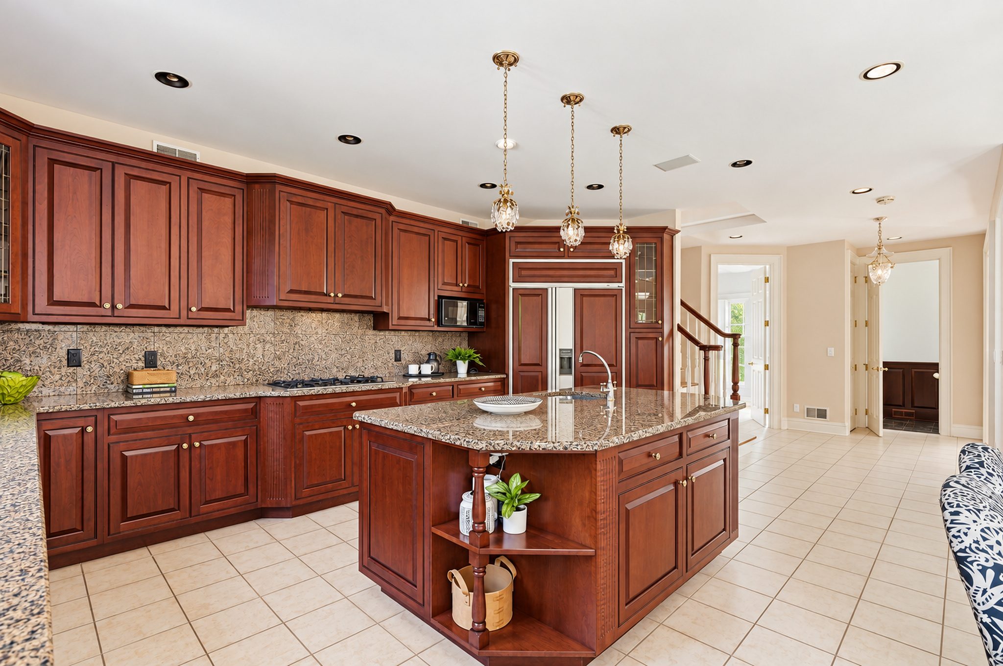Expansive kitchen with center island and pendant lighting at 54 Burnet Hill Road, Livingston