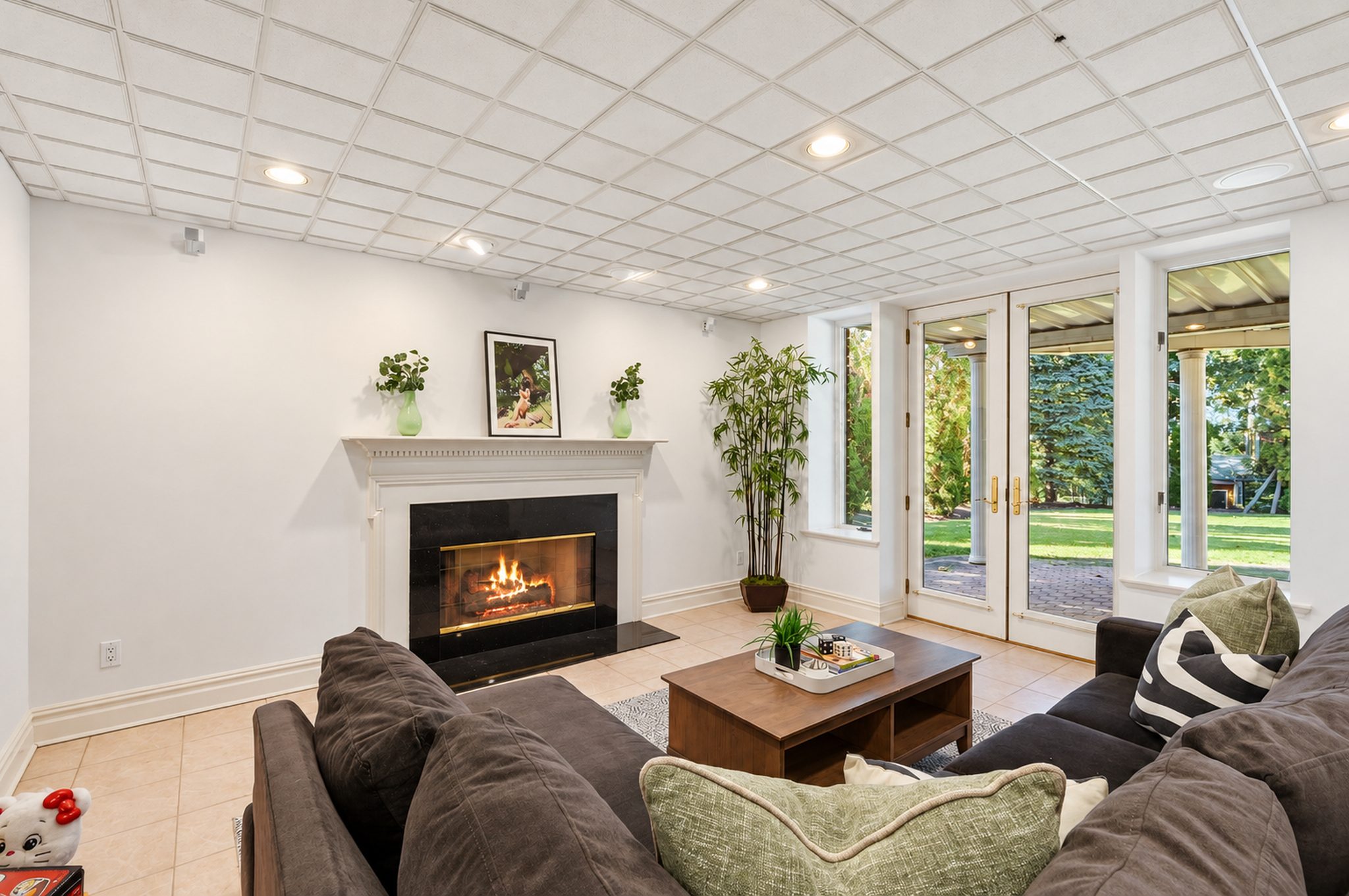 Lower level gas fireplace with walkout doors to the yard at 54 Burnet Hill Road, Livingston