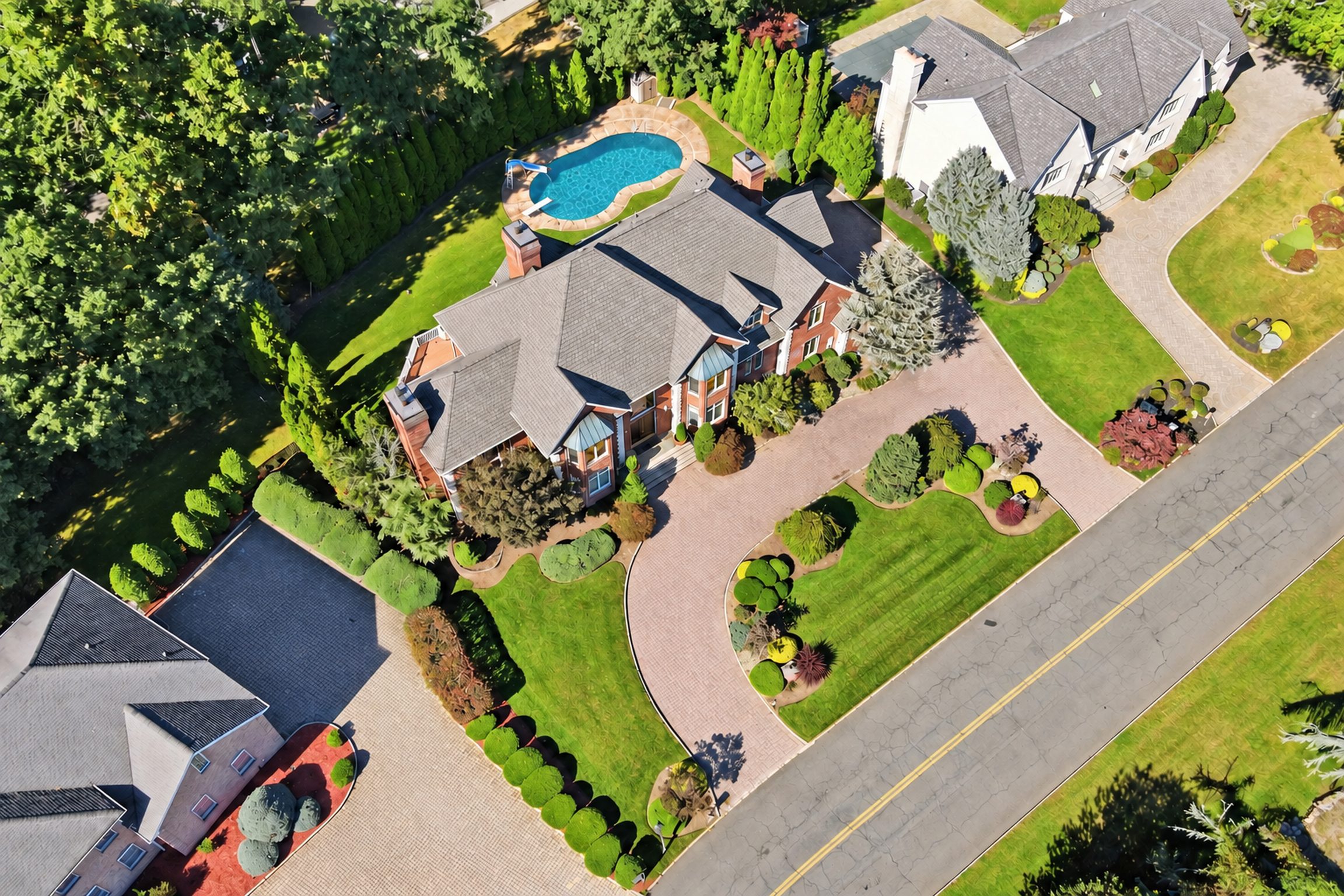 Overhead aerial of the residence, driveway and pool at 54 Burnet Hill Road, Livingston